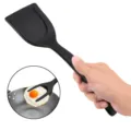 Zwarte nylon 2-in-1 spatel en tang voor gebakken ei, handig kookgerei voor in de keuken. - Zwart