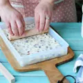 Detail shot of plastic nougat tray and wooden rolling pin tool set for DIY baking use. - Nougat Mold Set