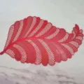 Hollow PVC leaf placemat, elegant red Nordic style heat-resistant table mat for kitchen. - Red