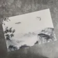 Chinese style PVC woven placemat featuring traditional ink landscape design for dining table. - Cloud Mist