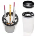 Nail brush cleaning cup detail view showing multi-hole holder and transparent container. - 11x6.5cm