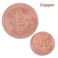 Detailed view of copper bitcoin commemorative coin with intricate circuit relief design. - Copper