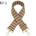 Detailed view of brown and white houndstooth jacquard bag strap with gold adjustable metal hardware. - B2-1 Brown and White Houndstooth