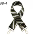 Detail view of green zebra print bag strap with durable gold hardware and adjustable buckle. - Gold Hardware / Army Green White Zebra Print