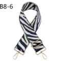 Detailed view of a trendy zebra pattern replacement bag strap with adjustable gold hardware. - Brown & Black Zebra Pattern