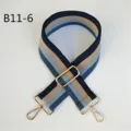 Close-up of the adjustable blue striped bag strap detail with golden metal hooks and buckles. - Gold / Style B11-6