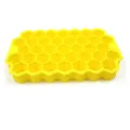 Silicone honeycomb ice cube tray detail view, 37 grid flexible mold close up showcase. - Yellow