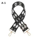 Detailed view of a wide argyle pattern replacement bag strap with gold metal hardware hooks. - A-1