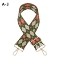 Detailed view of wide embroidered replacement bag strap with argyle pattern and gold hardware. - A-3