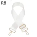 Detail van een witte vervangende tasband met verstelbare gouden metalen hardware componenten. - Wit