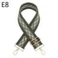 Close-up of ethnic woven bag strap with geometric diamond pattern and gold metal hardware. - Gold / E8