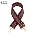 Close-up of ethnic woven bag strap, geometric pattern with gold tone adjustable metal hardware. - E11