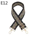 Close up of ethnic geometric woven bag strap with adjustable gold metal hardware and clasps. - E12