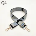 Adjustable camo replacement bag strap with shiny gold metal clasps and slider buckle detail. - Q4