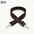 Detail close-up of adjustable zebra pattern bag strap with gold metal hardware and clips. - Silver Buckle / Zebra Pattern W4