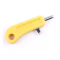 Macadamia nut opener tool with yellow plastic handle and metal tip for easy shell cracking. - Yellow