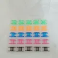 Detailed view of colorful plastic sewing machine bobbins neatly organized in a clear storage box. - Multicolor