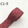 Vista dettagliata del nastro jacquard rosso con trama fine, perfetto per cucito e accessori borse. - C1-9 Borgogna