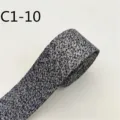 Primo piano dettagliato del nastro in tessuto misto nero e bianco per accessori moda. - C1-10 Nero e Bianco Misto