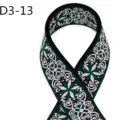 Close-up view of ethnic jacquard webbing strap detail, green and white woven pattern fabric. - D3-13