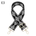 Correa de repuesto geométrica tejida en blanco y negro con detalles de metal dorado. - Dorado / Negro y Blanco