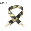 Detailed view of replacement camo bag strap with gold-tone metal hardware and adjustable buckle. - A19-2