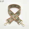 Detailed view of ethnic jacquard bag strap with adjustable gold metal hardware buckles. - Gold / C-27 Brown Edge Green Floral