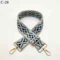 Detailed view of ethnic style jacquard bag strap with blue geometric pattern and gold hardware. - Gold / C-28 Light Blue Floral
