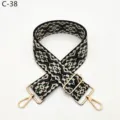 Detailed view of ethnic jacquard bag strap, black and green geometric weave with gold hardware. - Gold / C38 Dark Green