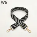 Detailed view of black and white zebra pattern replacement bag strap with gold metal hardware. - Zebra Pattern W6
