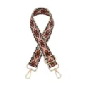 Close-up of bohemian woven ethnic geometric pattern strap detail with metal buckle hardware. - Silver Buckle / Z28 Black Orange
