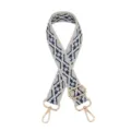 Detailed view of adjustable woven bag strap with ethnic geometric pattern and gold hardware. - Silver Buckle / Z24 Light Blue Floral