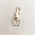 Mosquetón giratorio dorado de aleación para herrajes de bolsos, llaveros y manualidades DIY. - Oro claro