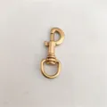 Gold metal lobster clasp detail shot, perfect for DIY bag hardware and accessories. - Gold