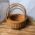 Set of three woven round picnic baskets with handles, ideal for storage and shopping. - Large + Medium + Small Round Watermelon Blue Set