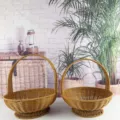 Detailed view of brown woven wicker picnic basket with handle and stable base for home use. - Rattan High Footed Basket Set of Two