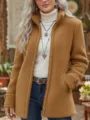 Detail shot of the women's caramel fleece zip-up jacket, soft teddy fabric texture close-up. - S / Tops / Brown