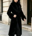 Stylish long black faux fur coat with plush collar, elegant wide cuffs and chic belted waist. - L / Black
