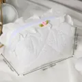 White lace cosmetic bag detail showing quilted texture and delicate floral ruffle accent. - Lace Trim Cosmetic Storage Bag