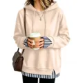 Dettaglio felpa con cappuccio ampia, elegante finto due pezzi con orlo a righe e maniche. - A righe albicocca
