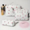 White quilted cosmetic bag set with red cherry print, large capacity travel storage organizer. - Three-Piece Set / Large Cherry Print Cosmetic Bag Set