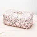 Detail view of the quilted leopard print cosmetic bag, showing texture and dual zipper design. - Leopard Print Multifunctional Hair Care Makeup Storage