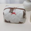 Quilted cosmetic bag featuring cute brown bear print and red bow, soft storage pouch. - Brown Bear