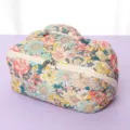 Quilted floral cosmetic bag, portable toiletry pouch with zipper and convenient handle design. - Floral Print