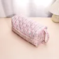 Detailed view of the pink floral quilted storage bag showing soft padded fabric and zipper. - Vine Floral Styling Handbag