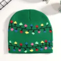 Detail view of green knit beanie featuring colorful Christmas light bulb pattern for winter holiday. - Green Colorful Lights