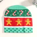 Close-up detail of a festive Christmas knitted beanie featuring gingerbread men and candy canes. - Fruit Green Gingerbread Man