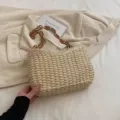Chic straw woven shoulder bag with brown chunky chain, perfect for casual summer beach vacation. - Off White