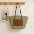 Green straw woven tote bag with brown leather straps and front pocket for summer beach - Green