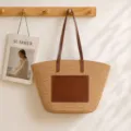 Handmade straw woven tote bag with brown leather handles and front pocket, stylish beach bag. - Khaki